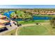 Scenic golf course view featuring lush green fairways, a tranquil lake, and beautifully landscaped surroundings at 4909 Clubview E Ct, Bradenton, FL 34203