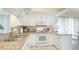 Charming kitchen with granite countertops, white cabinetry, and modern appliances at 4909 Clubview E Ct, Bradenton, FL 34203
