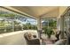 Relaxing screened lanai with comfortable seating and golf course views at 4909 Clubview E Ct, Bradenton, FL 34203