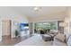 Comfortable living room with hardwood floors, neutral paint, and sliding glass doors to the covered patio at 4909 Clubview E Ct, Bradenton, FL 34203