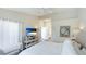 Spacious main bedroom featuring hardwood floors, neutral paint, lots of natural light and ensuite bathroom at 4909 Clubview E Ct, Bradenton, FL 34203