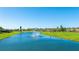 Picturesque pond view surrounded by lush greenery and well-maintained grounds at 4909 Clubview E Ct, Bradenton, FL 34203