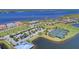 Community amenities featuring a pool, tennis courts, and lush landscaping in a beautiful waterfront setting at 5602 Tidewater Preserve Blvd, Bradenton, FL 34208