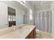 Bathroom featuring a vanity with granite countertop and a shower with curtain at 5602 Tidewater Preserve Blvd, Bradenton, FL 34208