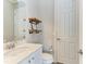 Bathroom featuring floating shelves, modern fixtures, and contemporary design at 5602 Tidewater Preserve Blvd, Bradenton, FL 34208