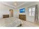 Bedroom showcases decorative wall paneling, wood floors, and a modern aesthetic at 5602 Tidewater Preserve Blvd, Bradenton, FL 34208
