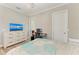 Bedroom with a dresser and TV plus work space at 5602 Tidewater Preserve Blvd, Bradenton, FL 34208