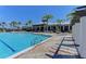 Resort-style community pool and clubhouse with a view on a clear and sunny day at 5602 Tidewater Preserve Blvd, Bradenton, FL 34208