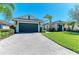 Lush landscaping surrounds this beautiful single Gathering home with a two-car garage at 5602 Tidewater Preserve Blvd, Bradenton, FL 34208
