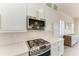 Kitchen features stainless steel appliances, granite counters, white subway tile backsplash and shiplap wall at 5602 Tidewater Preserve Blvd, Bradenton, FL 34208