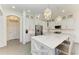 Modern kitchen featuring stainless steel appliances, a large island, and plenty of white cabinetry at 5602 Tidewater Preserve Blvd, Bradenton, FL 34208