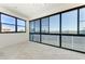 Screened lanai with tile flooring and views of the surrounding lake and landscape at 5602 Tidewater Preserve Blvd, Bradenton, FL 34208