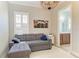 Living room with a comfortable sectional couch and a view into the bathroom at 5602 Tidewater Preserve Blvd, Bradenton, FL 34208