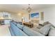 Open living room showcasing a sectional sofa, shiplap wall, and stylish furnishings at 5602 Tidewater Preserve Blvd, Bradenton, FL 34208