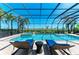 Gorgeous swimming pool with hot tub features stylish lounge chairs and views of serene greenery at 5602 Tidewater Preserve Blvd, Bradenton, FL 34208