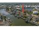 Drone view of the property with direct access to the canal, a private boat dock and easy ocean access at 5715 Sea Trout Pl, Apollo Beach, FL 33572