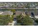 Aerial view of a waterfront home showcasing access to the canal, mature landscaping, and community at 5715 Sea Trout Pl, Apollo Beach, FL 33572