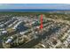 Aerial view captures waterfront homes with boating access, complemented by scenic water and coastal views at 5715 Sea Trout Pl, Apollo Beach, FL 33572