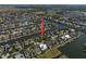 Overhead view of a waterfront neighborhood with private docks, serene water views, and lush landscaping at 5715 Sea Trout Pl, Apollo Beach, FL 33572