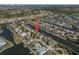 Expansive aerial shot showcasing waterfront community, complete with private boat docks and landscaped yards at 5715 Sea Trout Pl, Apollo Beach, FL 33572