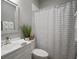 Clean, neutral bathroom with a shower and bathtub combination, plus vanity at 5715 Sea Trout Pl, Apollo Beach, FL 33572