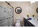 Modern bathroom featuring a glass enclosed shower, vanity, and decor at 5715 Sea Trout Pl, Apollo Beach, FL 33572