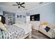 Relaxing bedroom with a soft color scheme, comfortable chair, and ample storage for a clutter-free sanctuary at 5715 Sea Trout Pl, Apollo Beach, FL 33572