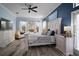 Comfortable bedroom featuring a nautical theme and an ample supply of natural light throughout at 5715 Sea Trout Pl, Apollo Beach, FL 33572