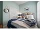 Inviting bedroom features seaside decor, comfortable furnishings, and soft lighting at 5715 Sea Trout Pl, Apollo Beach, FL 33572