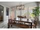 Bright dining room with modern lighting, large windows, and access to outdoor views; perfect for Gathering meals at 5715 Sea Trout Pl, Apollo Beach, FL 33572