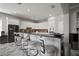 Spacious kitchen with bright white cabinets, dark countertops, and stainless-steel appliances, perfect for cooking at 5715 Sea Trout Pl, Apollo Beach, FL 33572