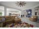 Open-concept living space with a seamless design flowing into the kitchen and dining area at 5715 Sea Trout Pl, Apollo Beach, FL 33572