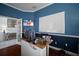Spacious home office with white board, desk, and stylish decor, perfect for remote work at 5715 Sea Trout Pl, Apollo Beach, FL 33572