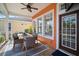 Outdoor dining area with a table, seating, and views of the surrounding backyard and community at 5715 Sea Trout Pl, Apollo Beach, FL 33572