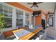 Inviting outdoor patio featuring a dining table, comfortable seating, and a ceiling fan for added comfort at 5715 Sea Trout Pl, Apollo Beach, FL 33572
