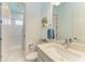 Well-lit bathroom with modern fixtures, a walk-in shower, and a stylish vanity at 5822 Title Row Dr, Bradenton, FL 34210