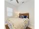 Cozy bedroom with wood headboard, natural light and stylish bedding at 5822 Title Row Dr, Bradenton, FL 34210