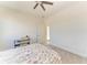 Spacious bedroom features a ceiling fan, ensuite bathroom, and a desk at 5822 Title Row Dr, Bradenton, FL 34210