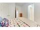 Bright bedroom with a view of the house, closet space, and stylish bedding at 5822 Title Row Dr, Bradenton, FL 34210