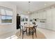 Bright breakfast nook featuring a view of the lake and white cabinets at 5822 Title Row Dr, Bradenton, FL 34210