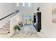 Bright foyer features soaring ceilings, elegant decor, and a clear view of the front door and the outside landscape at 5822 Title Row Dr, Bradenton, FL 34210
