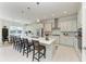 Well-lit kitchen with stainless steel appliances, a large island, and stylish pendant lighting at 5822 Title Row Dr, Bradenton, FL 34210