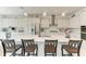 Kitchen featuring white cabinetry, stainless steel appliances, and a spacious center island at 5822 Title Row Dr, Bradenton, FL 34210