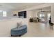 Open floor plan boasting tiled floors, a spacious living room and a wet bar with stylish backsplash at 5822 Title Row Dr, Bradenton, FL 34210