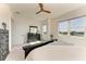 Main bedroom with a large bed, neutral colors, and plenty of natural light at 5822 Title Row Dr, Bradenton, FL 34210