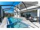 Spacious, screened-in lanai with a pool, spa and dining area, perfect for entertaining and relaxing at 5822 Title Row Dr, Bradenton, FL 34210