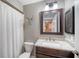 Updated bathroom with vanity, granite countertop, framed mirror, shower and tiled floors at 6033 34Th W St # 35, Bradenton, FL 34210