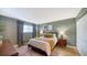 Cozy bedroom with a bed, nightstands, lamps, and stylish decor at 6033 34Th W St # 35, Bradenton, FL 34210