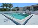 Community pool with ample deck space and lounge chairs in condo complex at 6033 34Th W St # 35, Bradenton, FL 34210