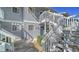 Exterior view of a two-story condo building with stairs leading to the second level at 6033 34Th W St # 35, Bradenton, FL 34210